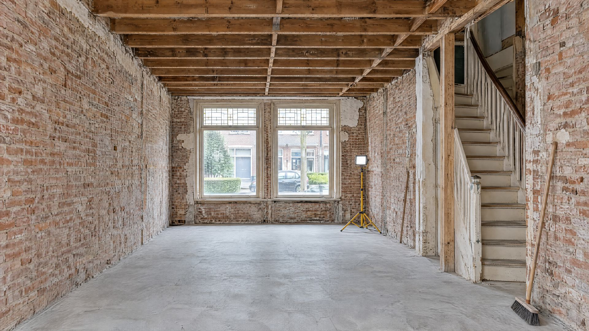 Ground floor of a terraced house fully stripped, with exposed joists